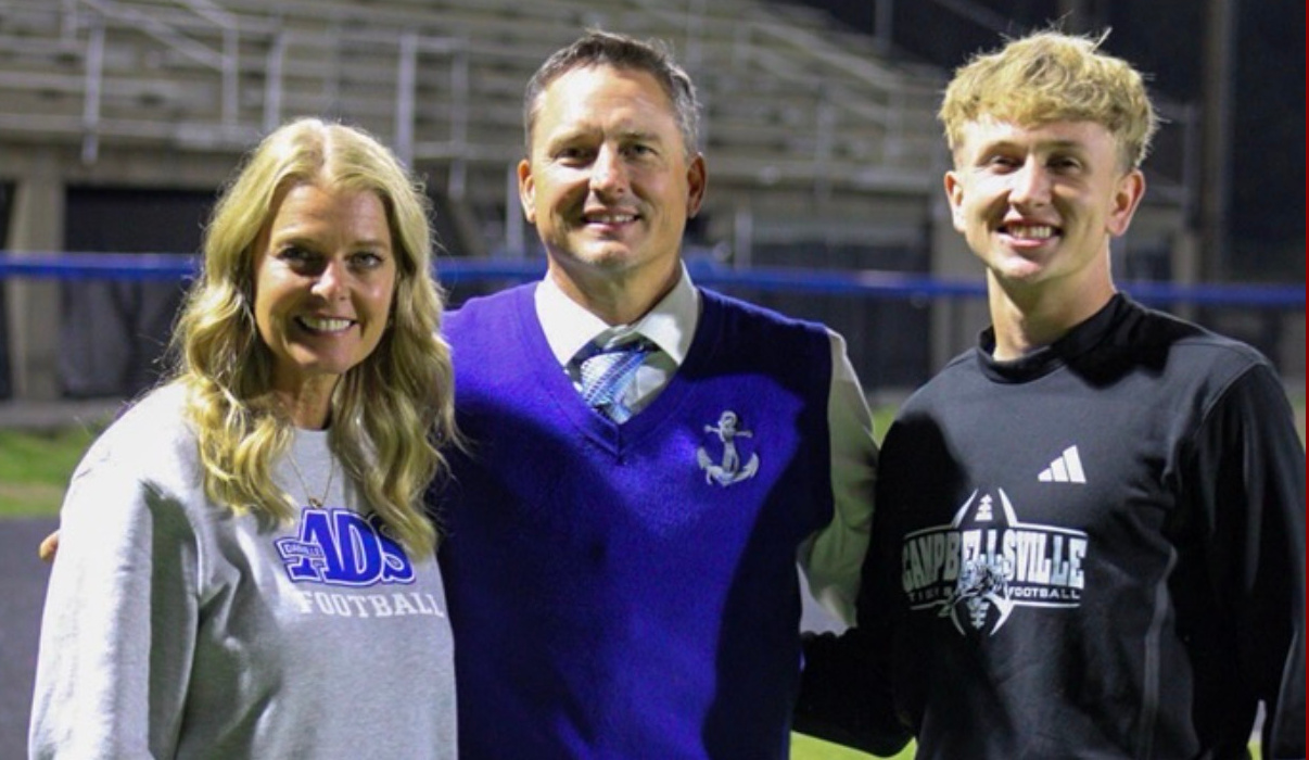 Steve Stonebraker (BCSG 2026 Coach of the Year) with wife Rachyl and son Solomon